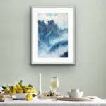 Framed ‘Night Wave’ in a coastal dining area, evoking the power and beauty of the ocean’s waves.