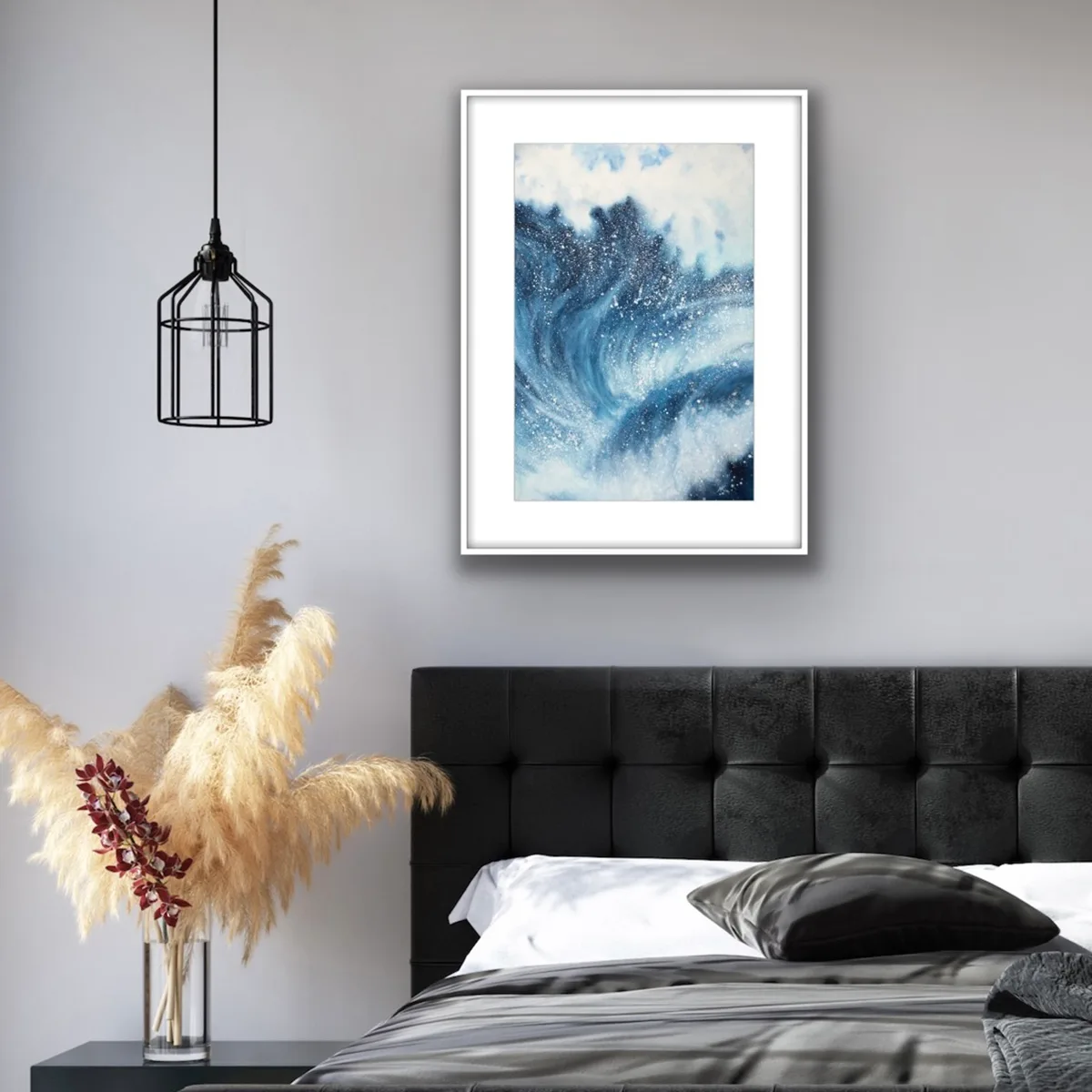 Framed ‘Night Wave’ in a contemporary bedroom, adding dramatic energy to the room with its bold ocean waves in deep navy blue tones.