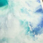 Close-up of the frothy foam and gentle wave crest in ‘Softness,’ illustrating the delicate, natural beauty of the ocean.