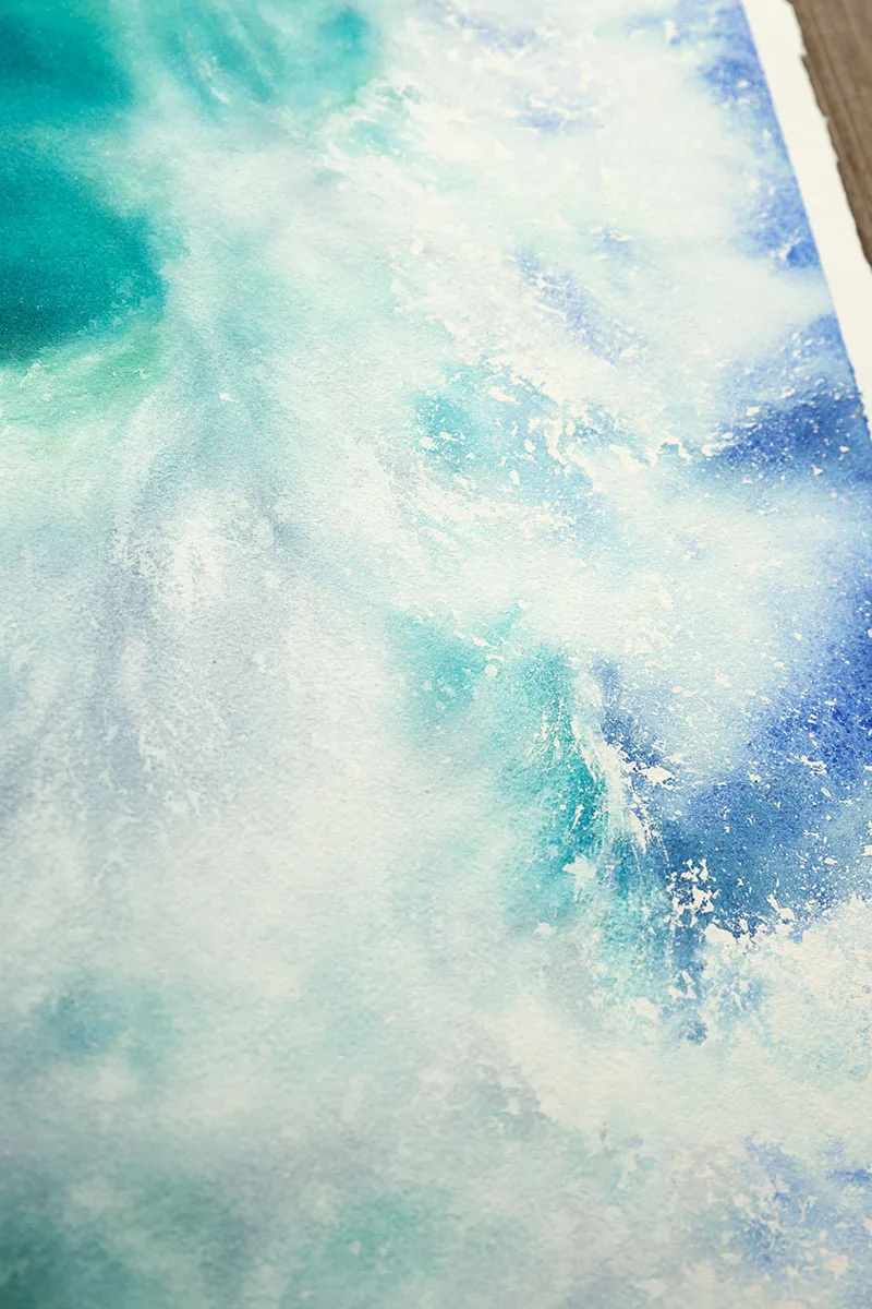 Close-up of the frothy foam and gentle wave crest in ‘Softness,’ illustrating the delicate, natural beauty of the ocean.