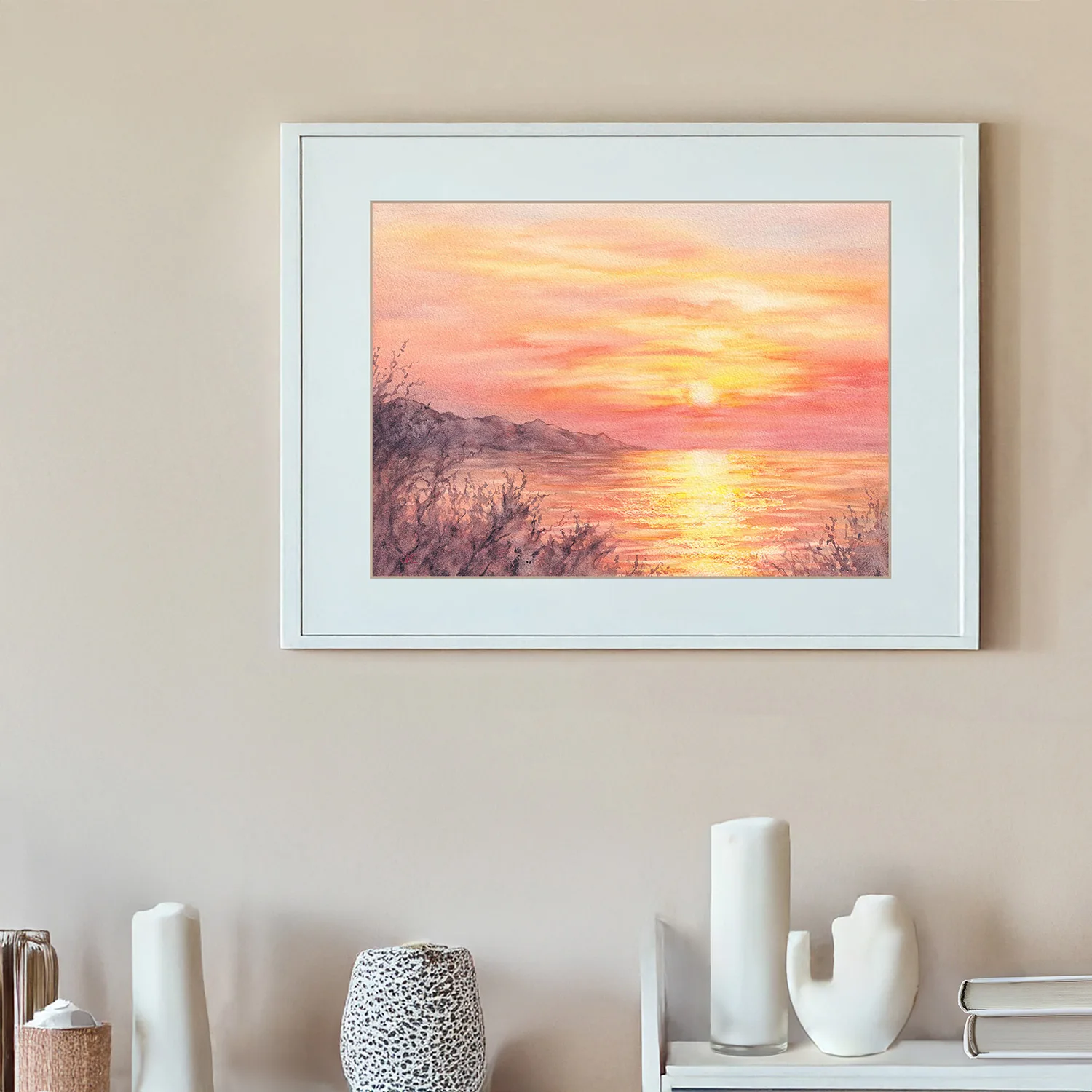 ‘Golden Sunset’ framed on the wall of a living room, adding a serene sunset scene with golden and warm hues to the coastal-inspired decor.