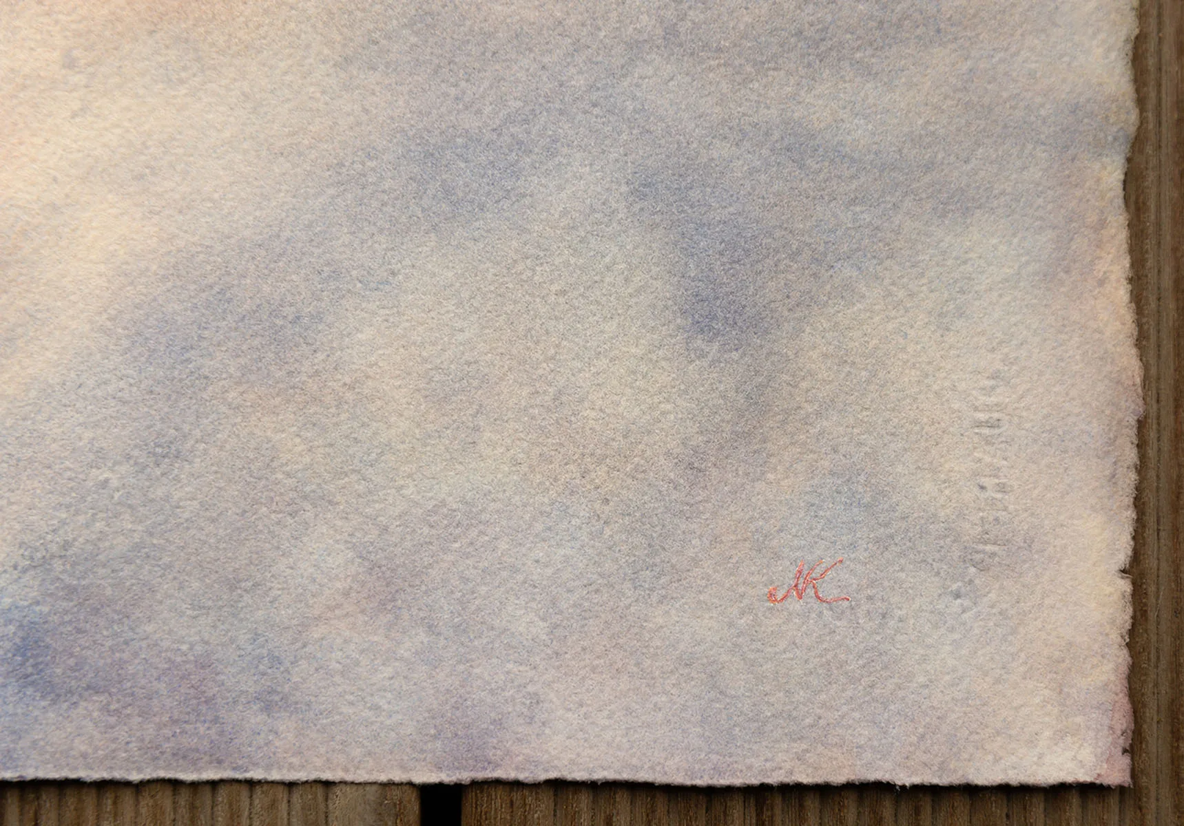 Detail of the artist’s signature on ‘Storm in Saint-Malo,’ displayed in the corner of the watercolor painting, authenticating the artwork by Kateryna Nazarenko.