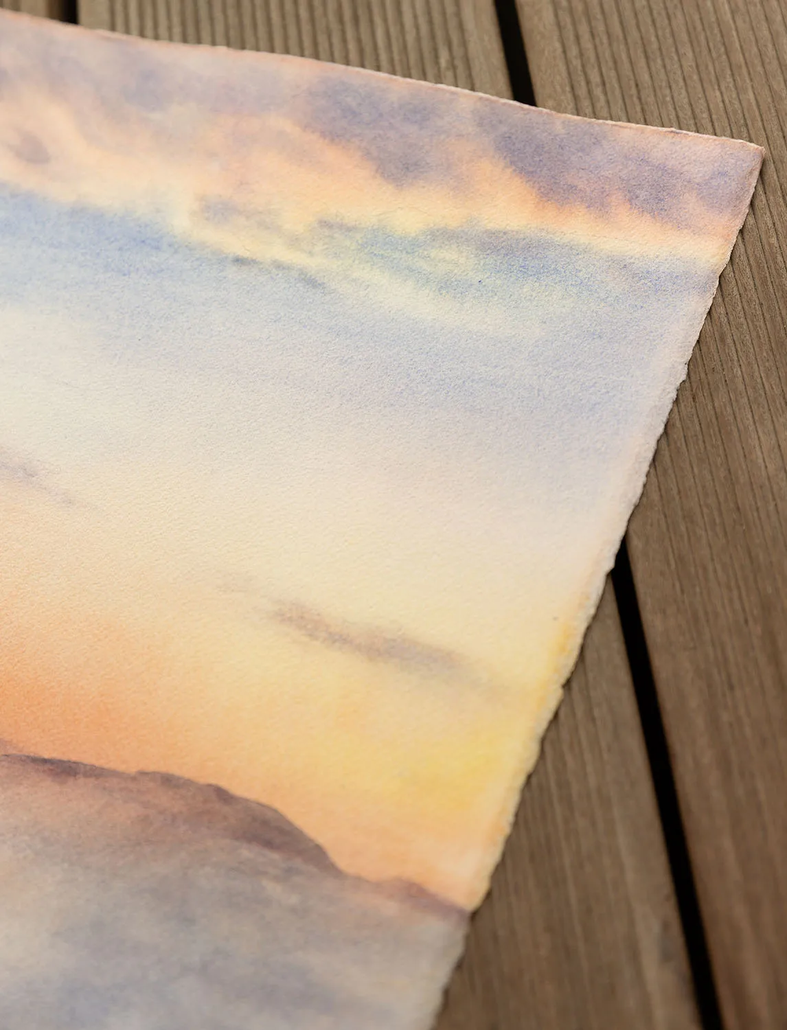 Close-up of the dramatic stormy sky in ‘Storm in Saint-Malo,’ showcasing deep shades of blue, purple, and orange blending into the turbulent atmosphere above the crashing waves.