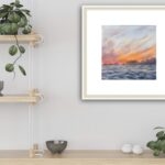 ‘Sunset by the Sea’ framed on a kitchen wall, reflecting the peaceful atmosphere of the ocean’s sunset colors.