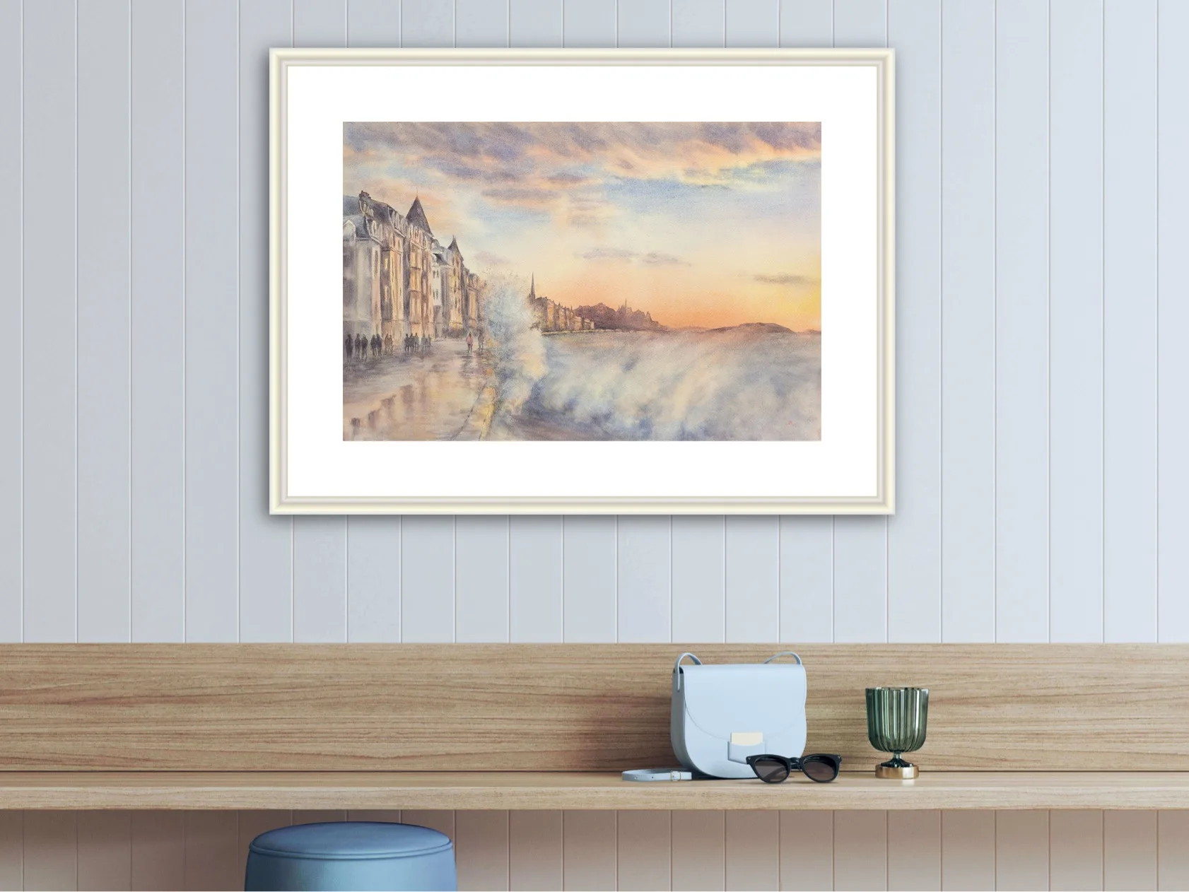 Framed watercolor of Saint-Malo’s coast, featuring dynamic ocean waves crashing under a sunset sky in soft hues.