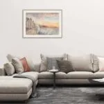 Framed painting of Saint-Malo, with crashing waves and a beautiful sunset captured in soft pastels and rich blues.
