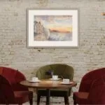 Framed watercolor of ‘Storm in Saint-Malo,’ capturing the energy of the sea and the serene beauty of the coastline under dramatic skies.