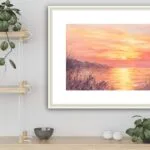 Framed ‘Golden Sunset’ in kitchen, enhancing the room with a beautiful sunset over the sea in glowing watercolor tones.