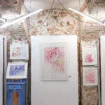 Pink Opuntia Cactus watercolor painting displayed on an exhibition wall, showcasing its soft pastel tones and delicate botanical details, adding elegance and tranquility to the art space.