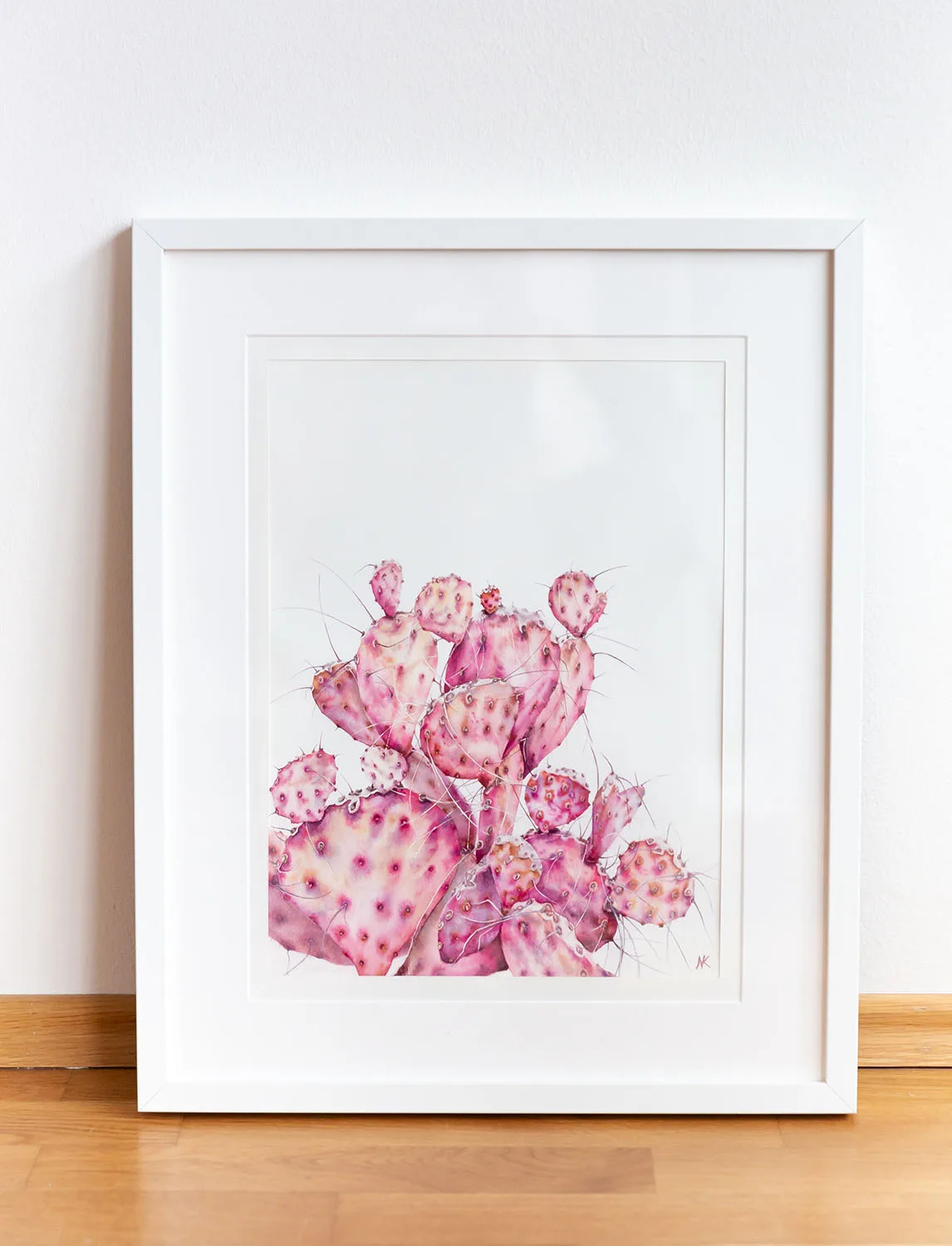 Pink Opuntia Cactus watercolor painting framed in a simple, modern frame, bringing a fresh botanical touch to any interior decor with its delicate pastel tones and intricate details.