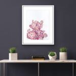 Watercolor cactus art framed in a modern living room, adding a serene and nature-inspired touch to the decor.
