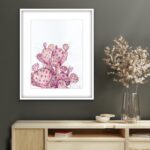 Pink Opuntia cactus watercolor painting displayed in a modern living room with soft natural decor, bringing a serene and elegant touch of botanical art with pastel tones to the space.