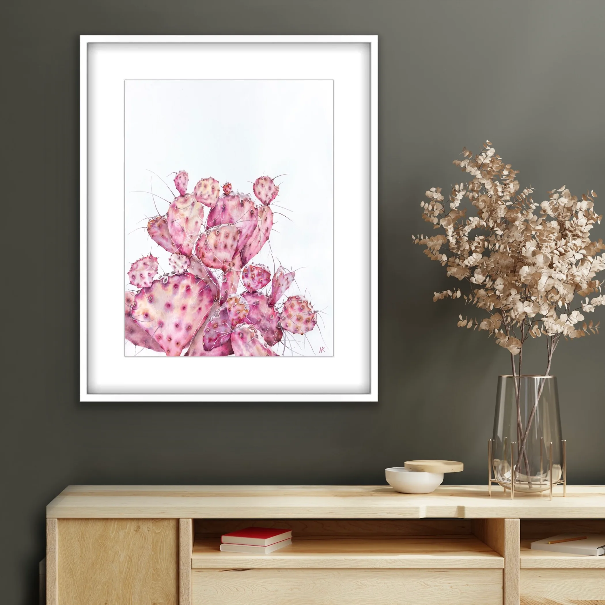 Pink Opuntia cactus watercolor painting displayed in a modern living room with soft natural decor, bringing a serene and elegant touch of botanical art with pastel tones to the space.
