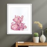 Pink Opuntia cactus watercolor painting framed on a living room wall, blending naturally into a nature-inspired decor, adding a soft and tranquil botanical touch with delicate pastel hues.
