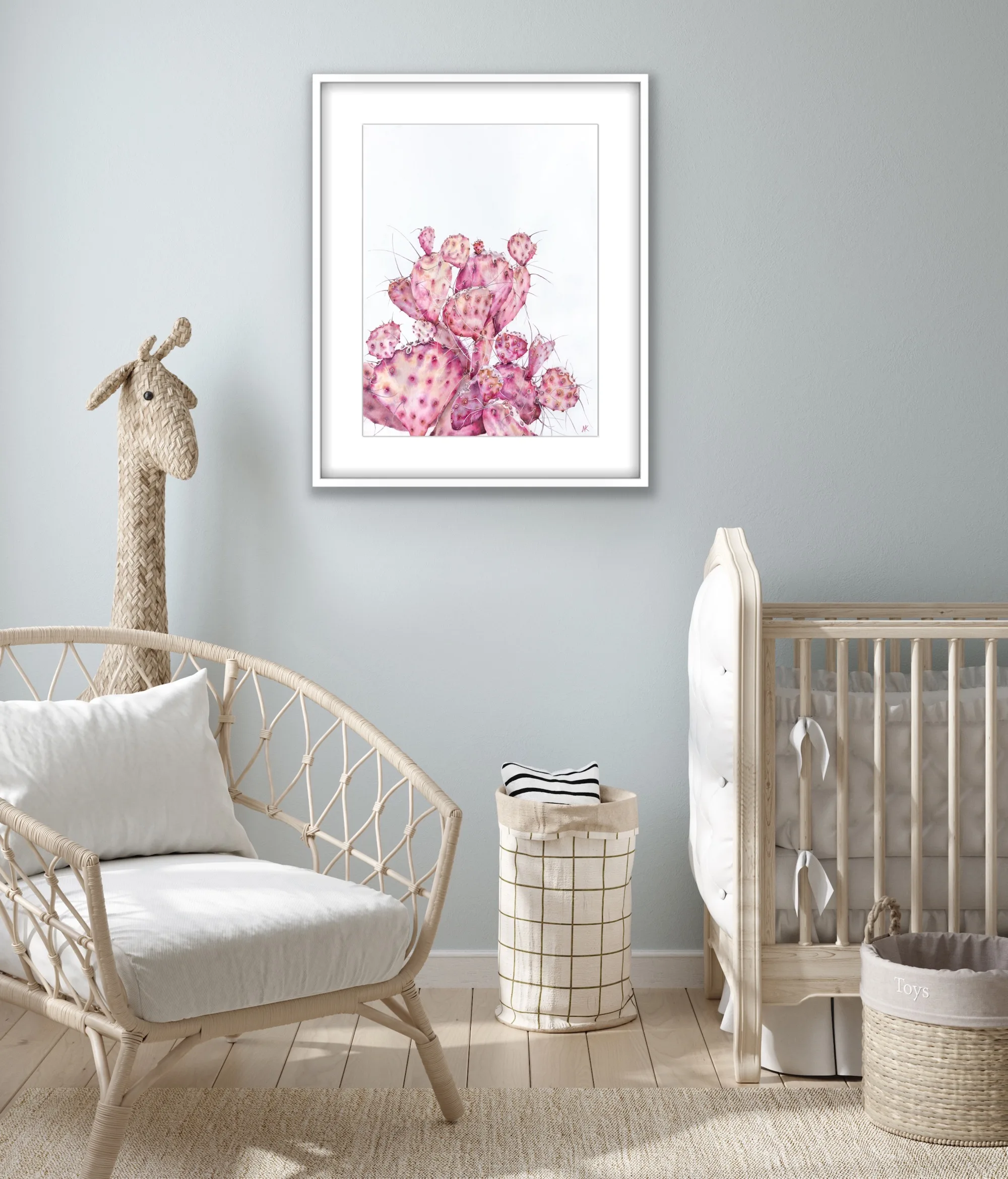Delicate watercolor of a pink Opuntia cactus hanging in a nursery, adding a soft touch of nature and tranquility to the baby room's serene decor.
