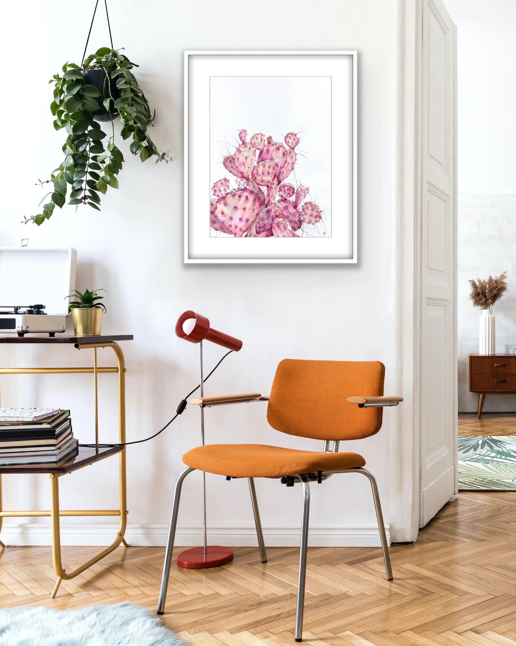 Watercolor cactus artwork featuring a pink opuntia cactus, creating a calm and nature-inspired ambiance in a home office.