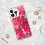 Red Poinsettia Christmas Flower MagSafe iPhone case styled with festive Christmas decor, perfect holiday floral clear case for iPhone 14, 15, and 16.