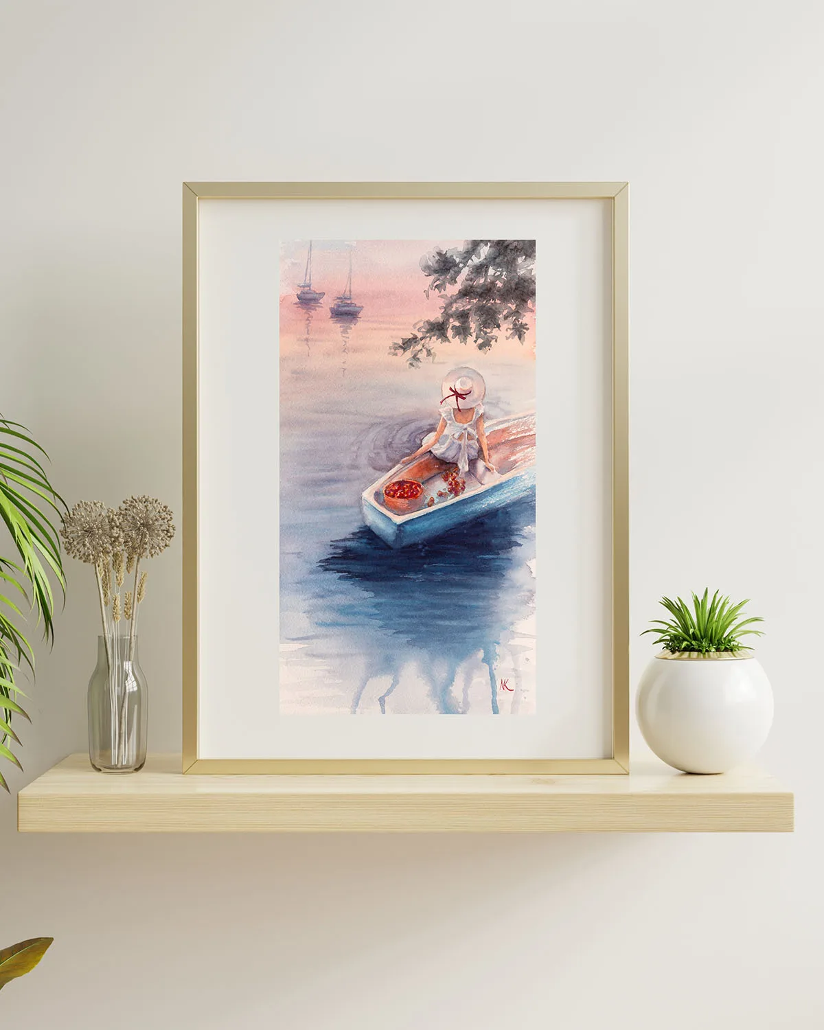 Dreamer – tranquil watercolor painting of a girl in a boat at sunset, elegantly displayed in a frame above a shelf, enhancing a cozy space.