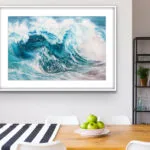 Coastal home decor featuring "Fragile but Strong" watercolor wave painting, enhancing a nautical-themed dining area.