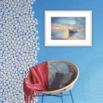 "Morning Solitude" framed watercolor seascape in a coastal blue room, enhancing the serene and nautical ambiance.