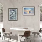 "Morning Solitude" framed watercolor seascape hanging in a loft dining room, adding a serene ocean-inspired touch.