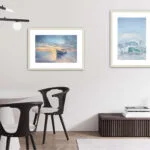 "Morning Solitude" seascape in a sleek modern living room, bringing soft blues and warm tones for a peaceful atmosphere.