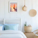 Sailing into the Sunset watercolor painting in a coastal bedroom, enhancing the relaxing seaside ambiance.