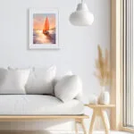 Sailing into the Sunset watercolor painting displayed in a modern living room, bringing a tranquil ocean atmosphere.