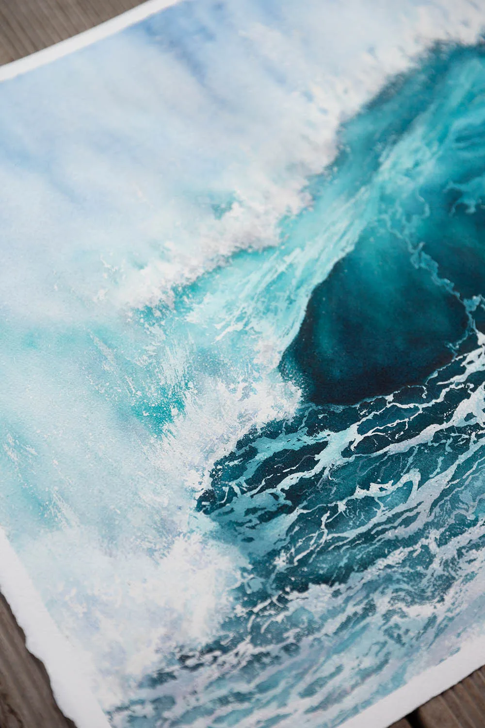 Focused detail of ocean foam, capturing dynamic white spray from the wave.