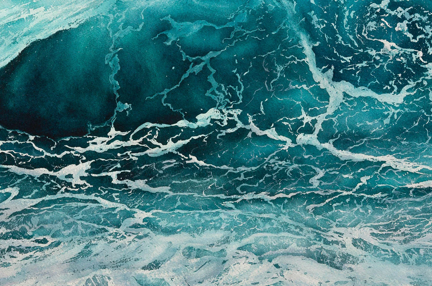 Close-up of a dynamic wave with deep blue and turquoise hues.
