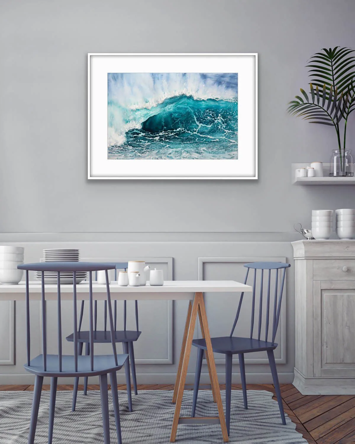 Splash watercolor artwork enhancing the coastal design of a bright dining room.