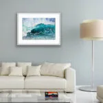 Splash seascape watercolor painting displayed in a cozy living room with ocean-themed decor.