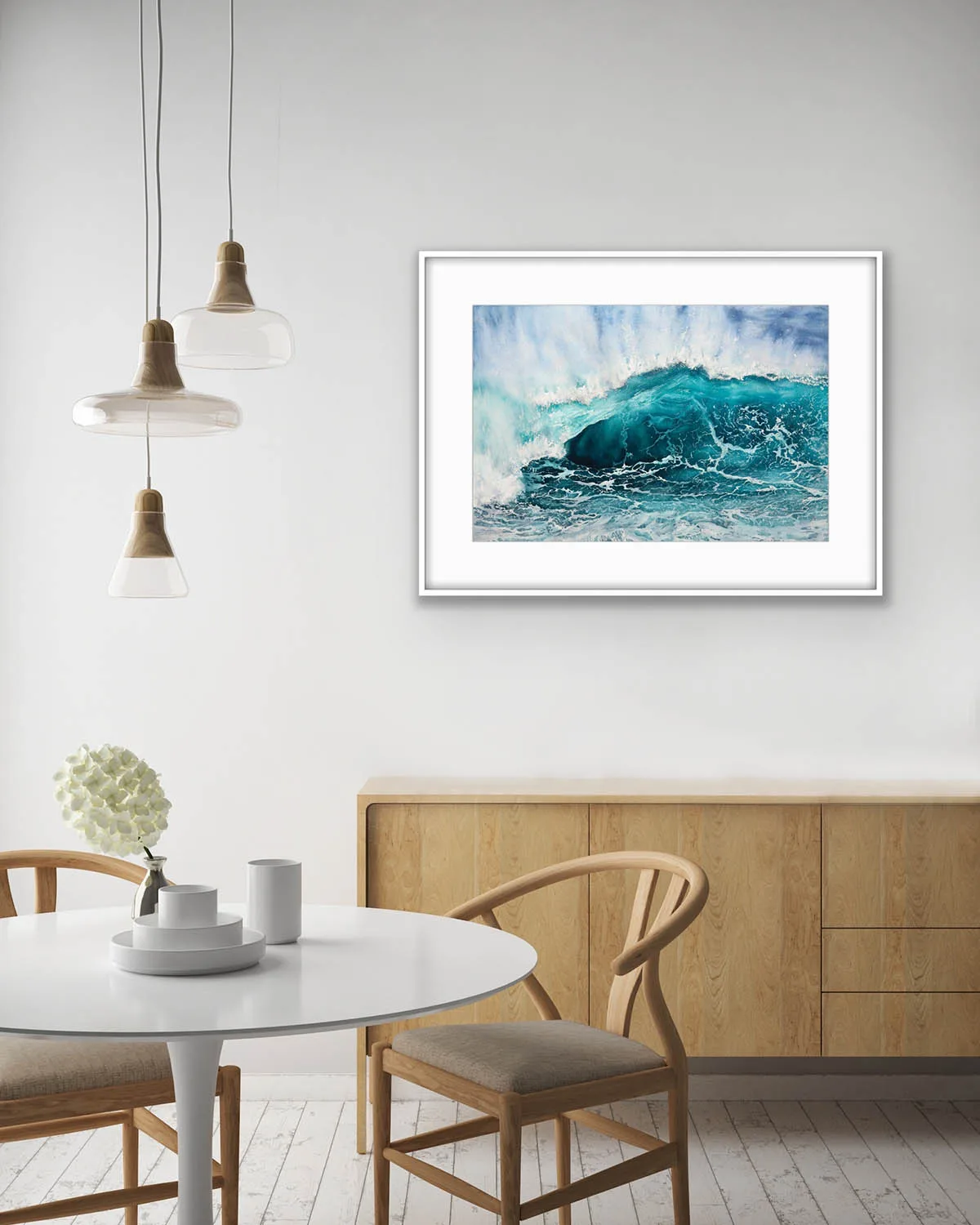 Splash painting framed in a contemporary dining room with coastal interior style.