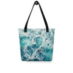 Teal blue ocean wave tote bag with a watercolor print of rolling waves and white sea foam, inspired by the rhythmic beauty of the sea.