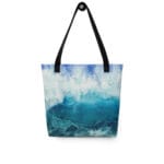 Ocean Wave Tote Bag featuring an ocean wave design in deep blues and turquoise, inspired by the watercolor painting "Through the Light" by Kateryna Nazarenko. Perfect for beach trips and shopping.