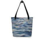 Sunset Ocean Tote Bag featuring a watercolor design of the ocean at sunset, with deep blues and soft grays creating a serene, calming, and contemplative vibe. Perfect for beach outings or daily use.