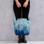 Woman carrying the Blue Ocean Tote Bag with watercolor ocean wave design – trendy and spacious coastal tote bag, perfect for summer outings, daily errands, and nature-inspired fashion lovers.