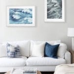 Ocean-themed living room with Blue Ocean Whisper wall art, blue abstract wave print bringing freshness and beach calm to home.