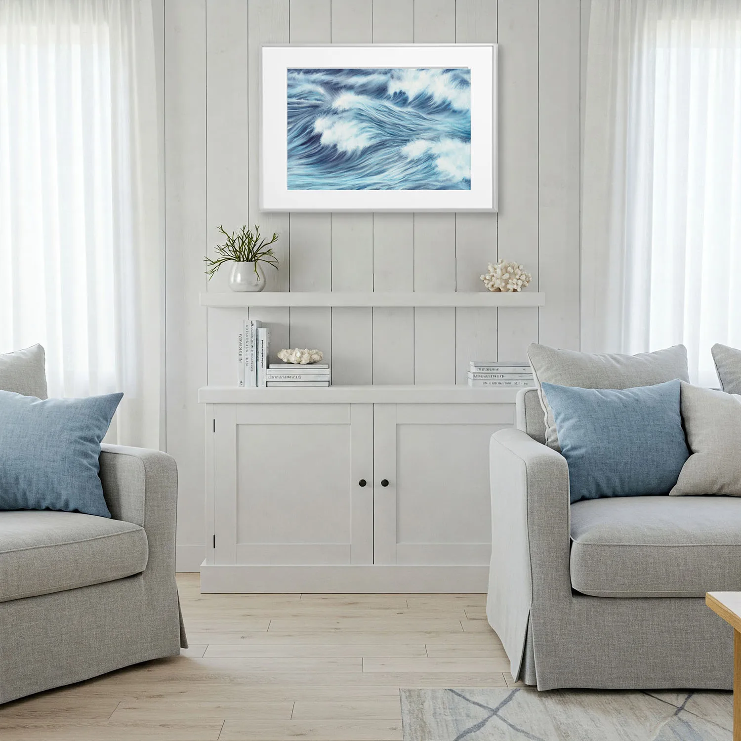 Framed Blue Ocean Whisper in light wood interior, modern ocean painting for coastal living room, soft wave movement and sea-inspired tones.