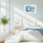 Bright bedroom with ocean wave print Blue Ocean Whisper, abstract blue seascape enhancing beach-style interiors with relaxing energy.