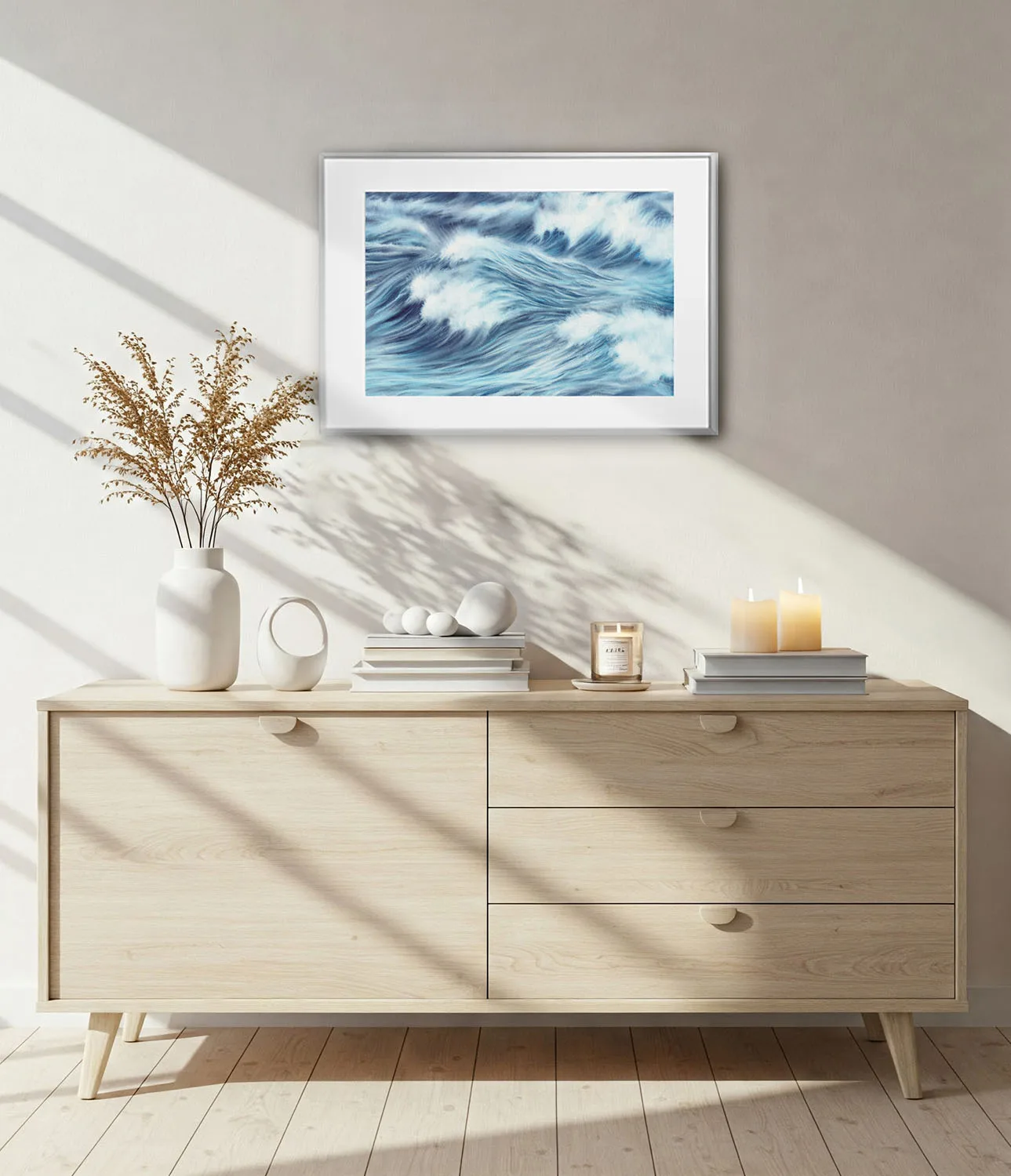 Ocean-inspired living room with framed Blue Ocean Whisper print, seascape wall art enhancing calm, coastal home ambiance.