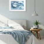 Minimalist bedroom with Blue Ocean Whisper watercolor ocean artwork, fine art print in soft blue tones ideal for tranquil sleep space.