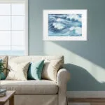 Blue-accented coastal interior with Blue Ocean Whisper artwork, modern wave print ideal for nautical and ocean decor enthusiasts.