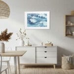 Nautical dining room decorated with Blue Ocean Whisper seascape art, modern ocean painting enhancing beach house wall decor.