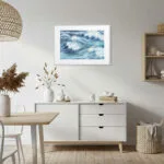 Nautical dining room decorated with Blue Ocean Whisper seascape art, modern ocean painting enhancing beach house wall decor.