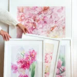 Dancing Tulips framed and placed in the artist’s studio, surrounded by art and natural light.