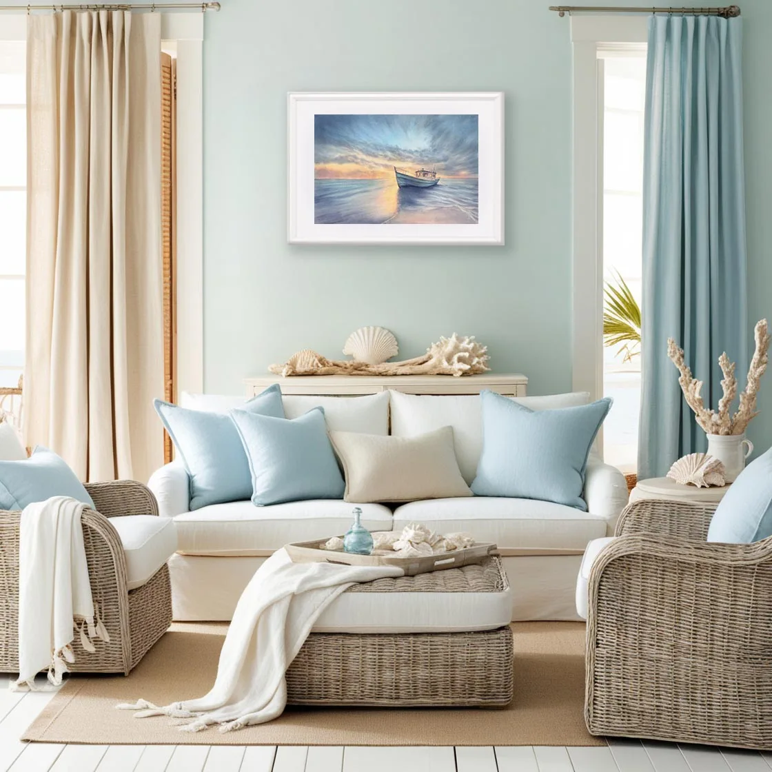 Original watercolor sunrise seascape print Morning Solitude with a peaceful ocean and boat, styled in a coastal living room filled with nature-inspired decor.