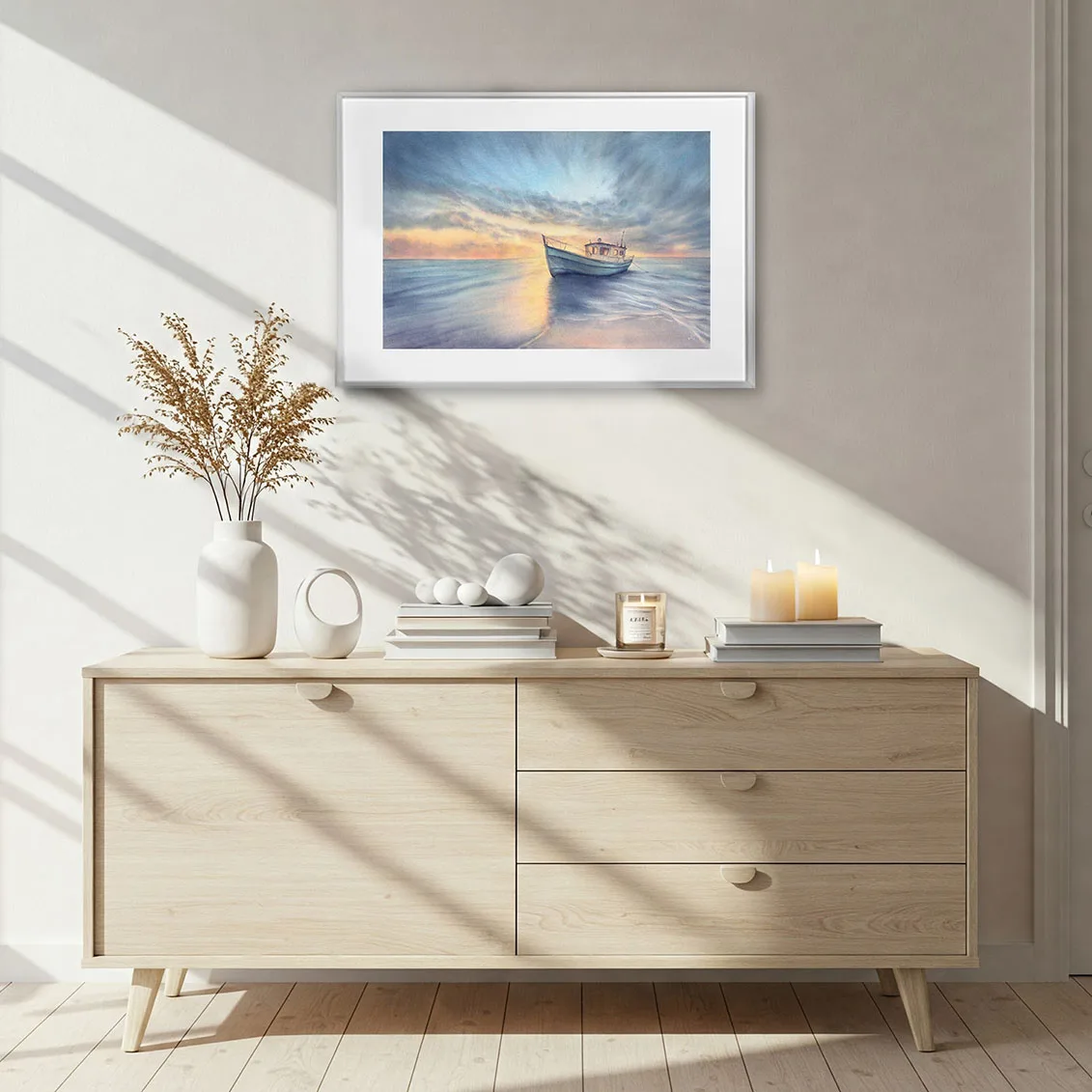 Fine art print of a peaceful ocean watercolor painting, Morning Solitude, featuring a sunrise seascape with a boat, framed and displayed above a dresser in serene coastal home decor.