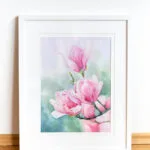 Pink Magnolias watercolor painting beautifully framed, enhancing the delicate charm of magnolia blossoms.