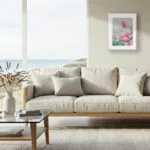 Pink Magnolias framed artwork adding a delicate botanical accent to a stylish living room decor.